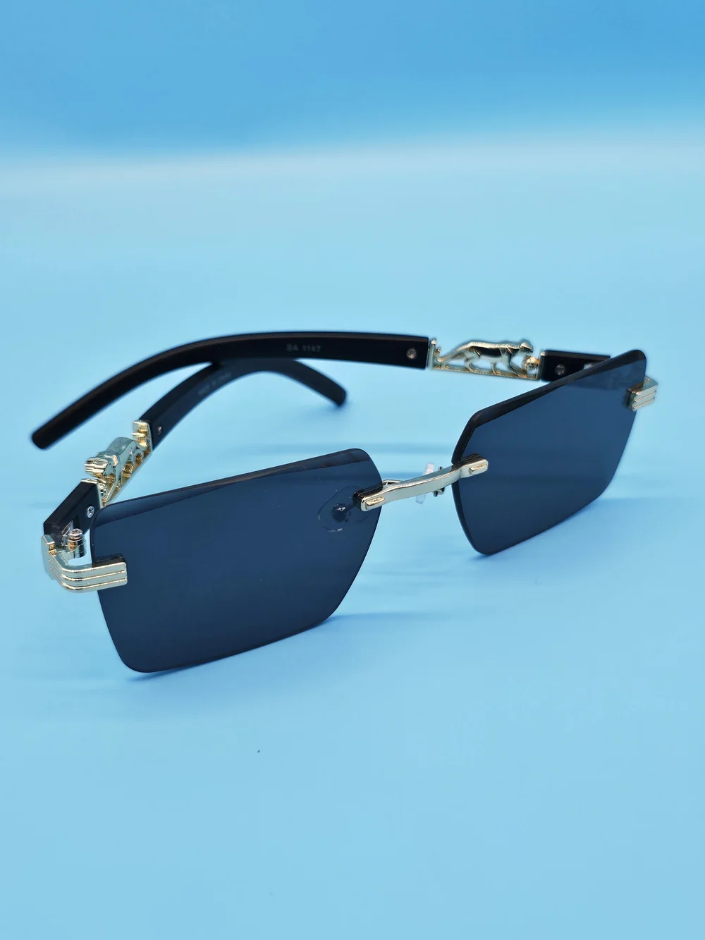 Men's Black and Gold Rimless Sunglasses